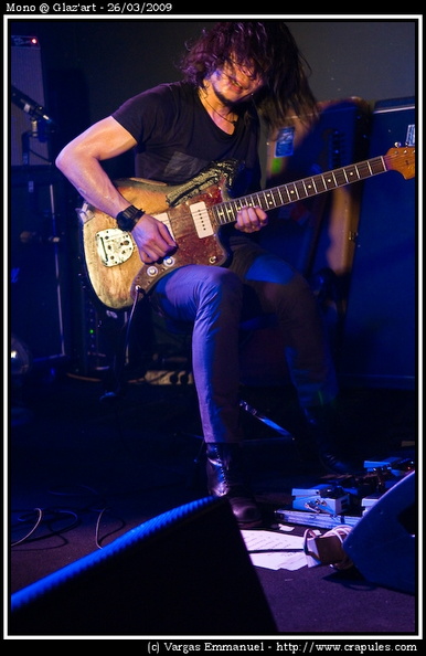 Mono @ Glaz'art Photo 8 - Mono Live in Paris @ Glaz'art for the "hymn to the immortal wind" tour. 2009-03-26.
Mono were founded in January 2000 by guitarist Takaakira Goto. The first member to join was fellow guitarist and long time friend Yoda. Soon afterwards the two guitarists linked up with bassist Tamaki and drummer Yasunori Takada.
All of Mono's songs are entirely instrumental, and Strings and pianos are also prominently featured in several songs.
In 2002, Mono finished their second album, One Step More and You Die. Many critics considered this as having a more distinctive sound than the preceding album.
Soon afterward, Mono moved on to a new project in direct response to the aftermath of September 11th. This album was titled New York Soundtracks and was recorded in collaboration with several important members of the New York experimental scene, such as DJ Olive, Jackie-O Motherfucker, and Loren Connors. New York Soundtracks consists of remixes of all of One Step More and You Die's tracks.
Following Soundtracks, Mono embarked on the production of their next album, Walking Cloud and Deep Red Sky, Flag Fluttered and the Sun Shined which was released on October 5, 2004. Following the release of this album, Mono began a lengthy world tour.
On June 24, 2006, Mono released their next album, You Are There. You Are There met similar success to Palmless Prayer / Mass Murder Refrain and was accompanied by worldwide tours throughout 2006 and 2007.
Mono, like most bands associated with the underground music scene, tries to maintain a strong relationship with their fans. Goto, in a recent interview with Semtex Magazine, pointed out that for Mono, promotion is not a priority, they tour "to meet the crowd". 20090326_Mono_07.jpg